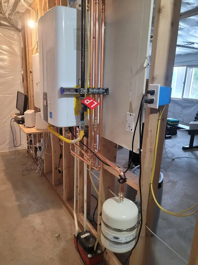 Licensed plumber repairing a kitchen sink in Barrington